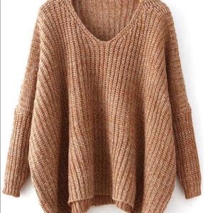Oversized sweater with plunging neckline.